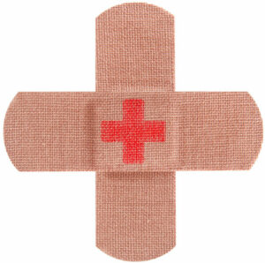 Two bandaids laid in a plus sign with a red cross sign in the center